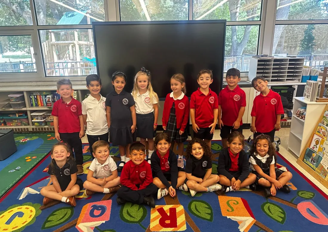 Kindergarten class photo on the classroom rug