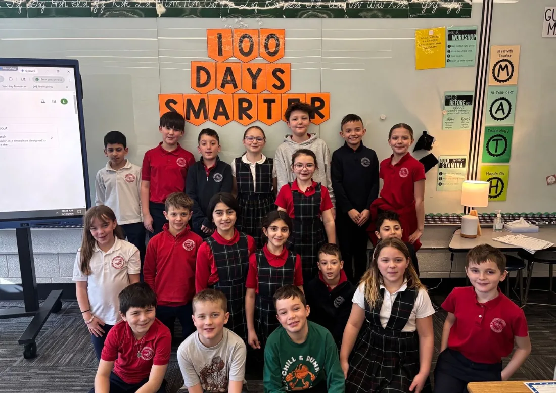 Students in a classroom celebrating the 100th day of school