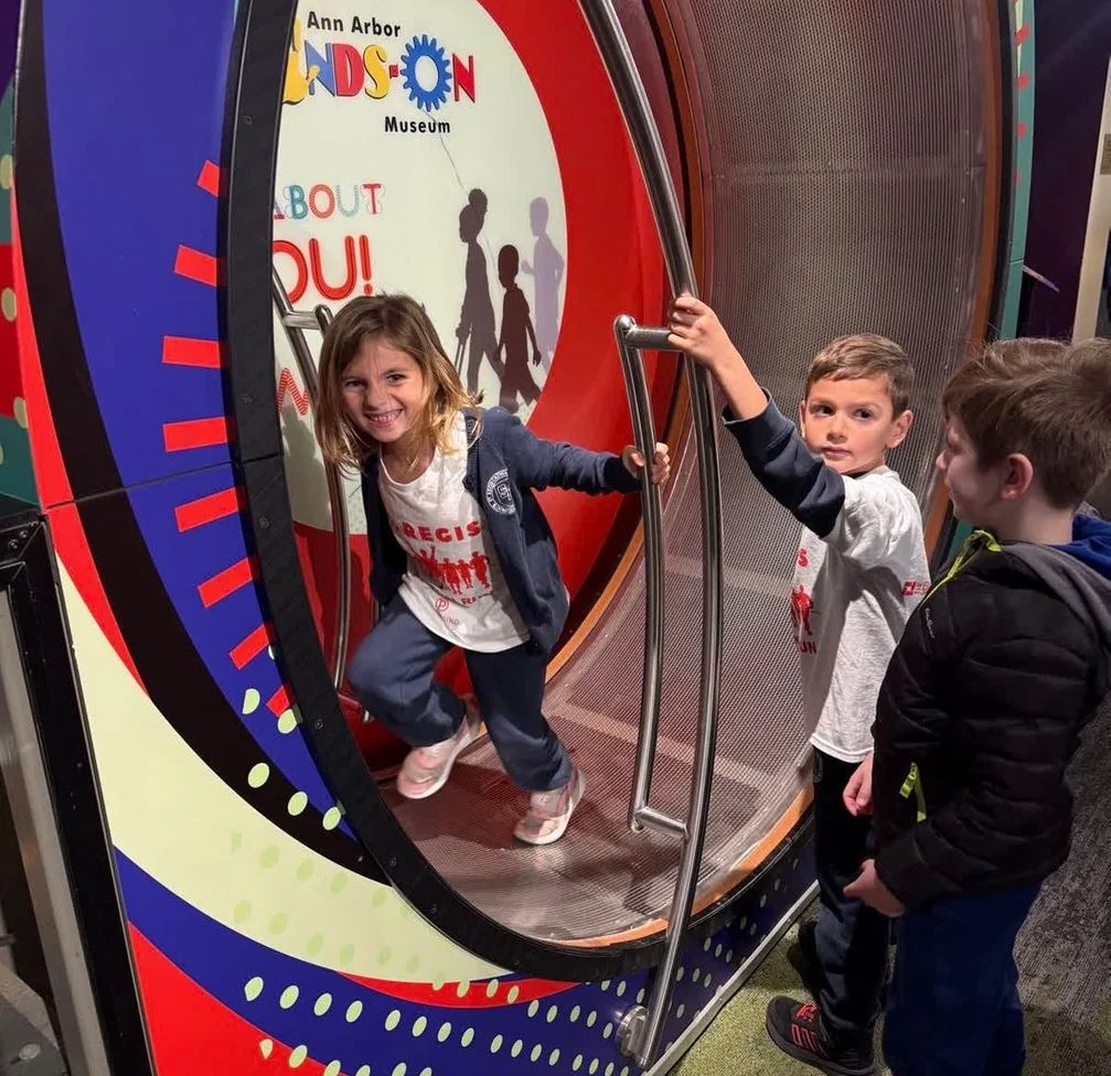 Young students exploring an exhibit at the Ann Arbor Hands-On Museum