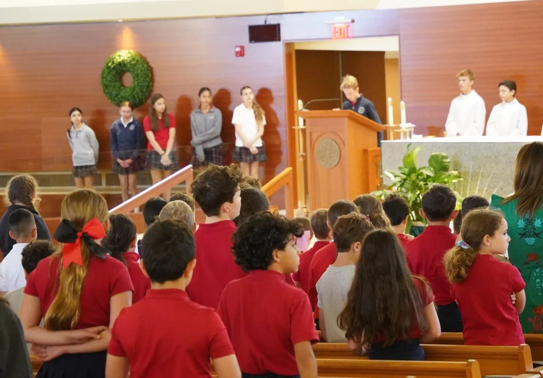 Students at a school Mass in church