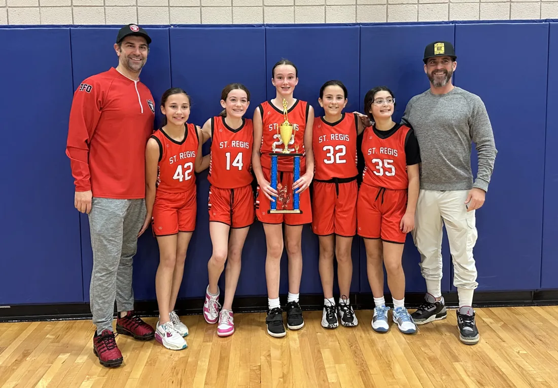 St. Regis CYO girls basketball team with coaches and trophy