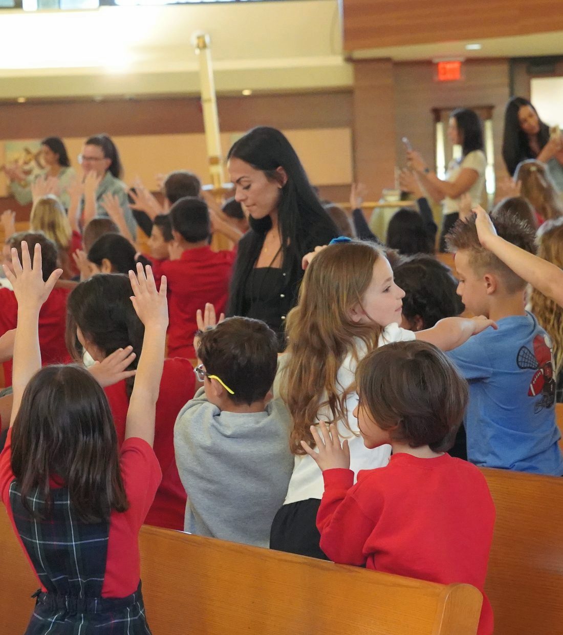 Students raising their hands during a lesson