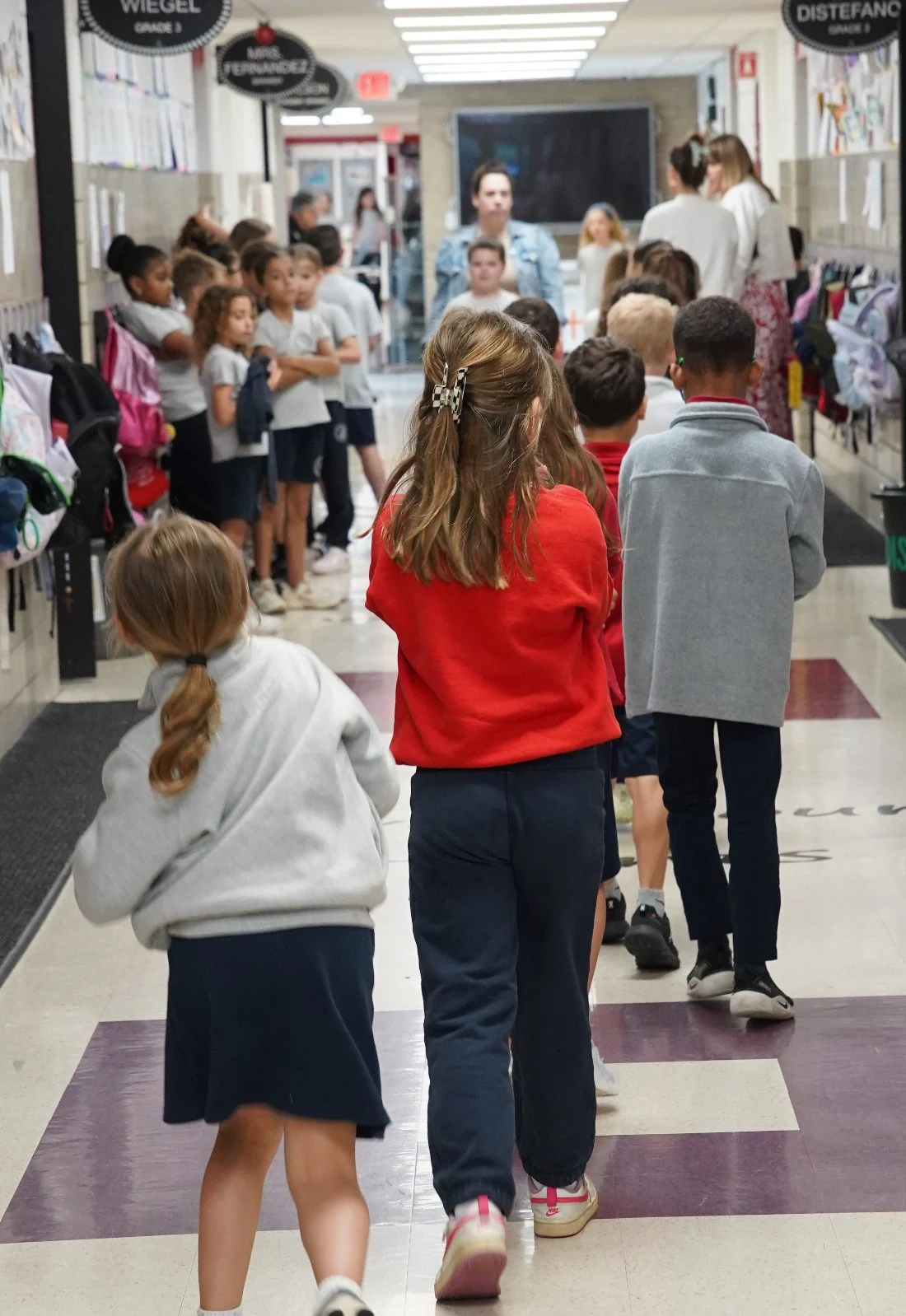 Students walking down the school hallway