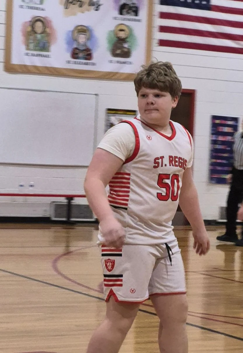 St. Regis basketball player on the court