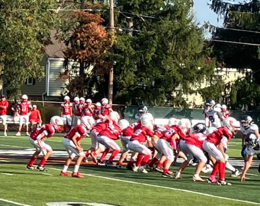 St. Regis Raiders football team at the line of scrimmage