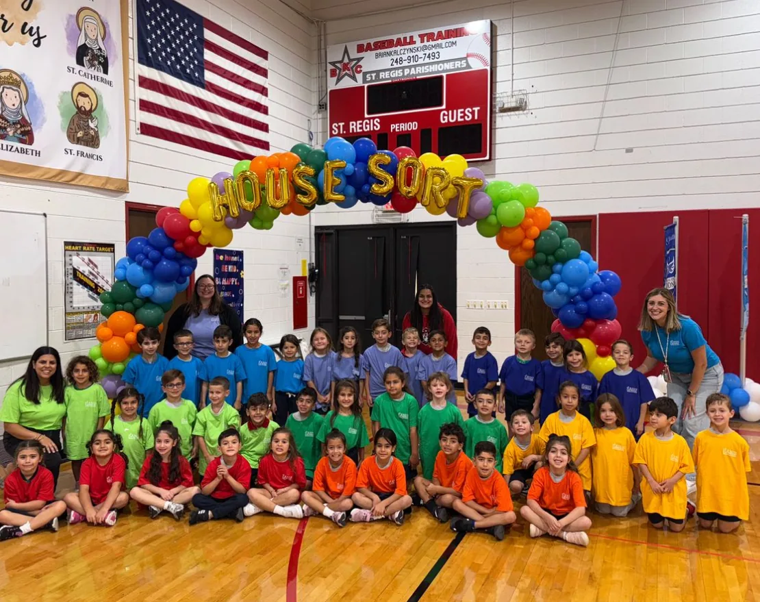 Students in house colors at the House Sort in the gym