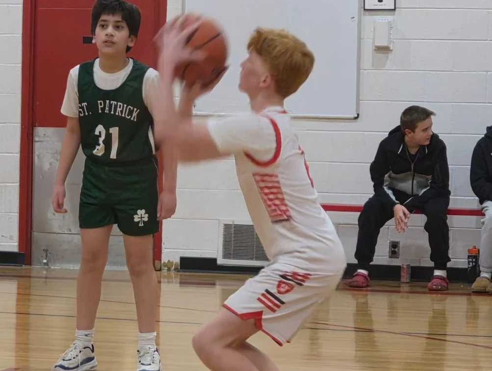 St. Regis basketball player taking a shot during a game