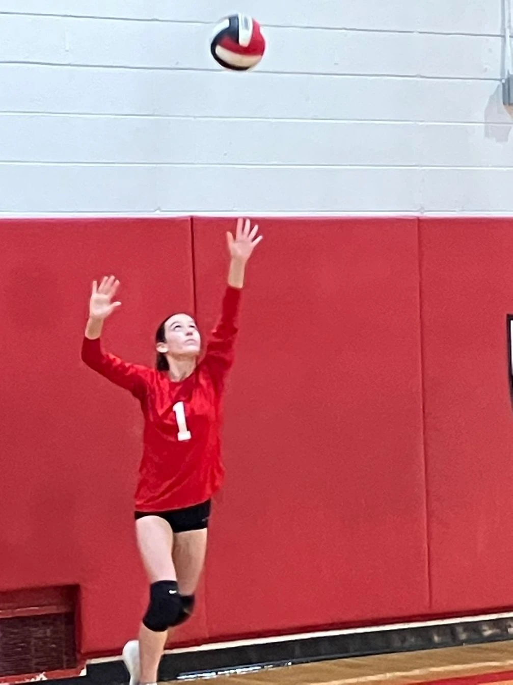 St. Regis volleyball player serving