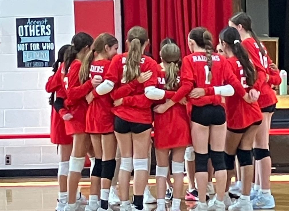 St. Regis Raiders volleyball team huddle