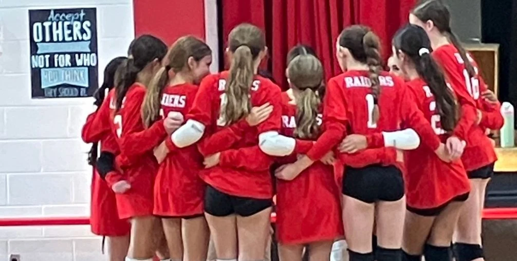 St. Regis Raiders volleyball team huddle
