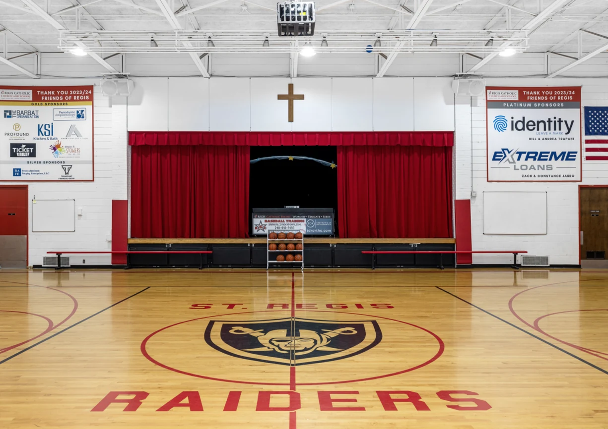 St. Regis gym with Raiders logo at center court