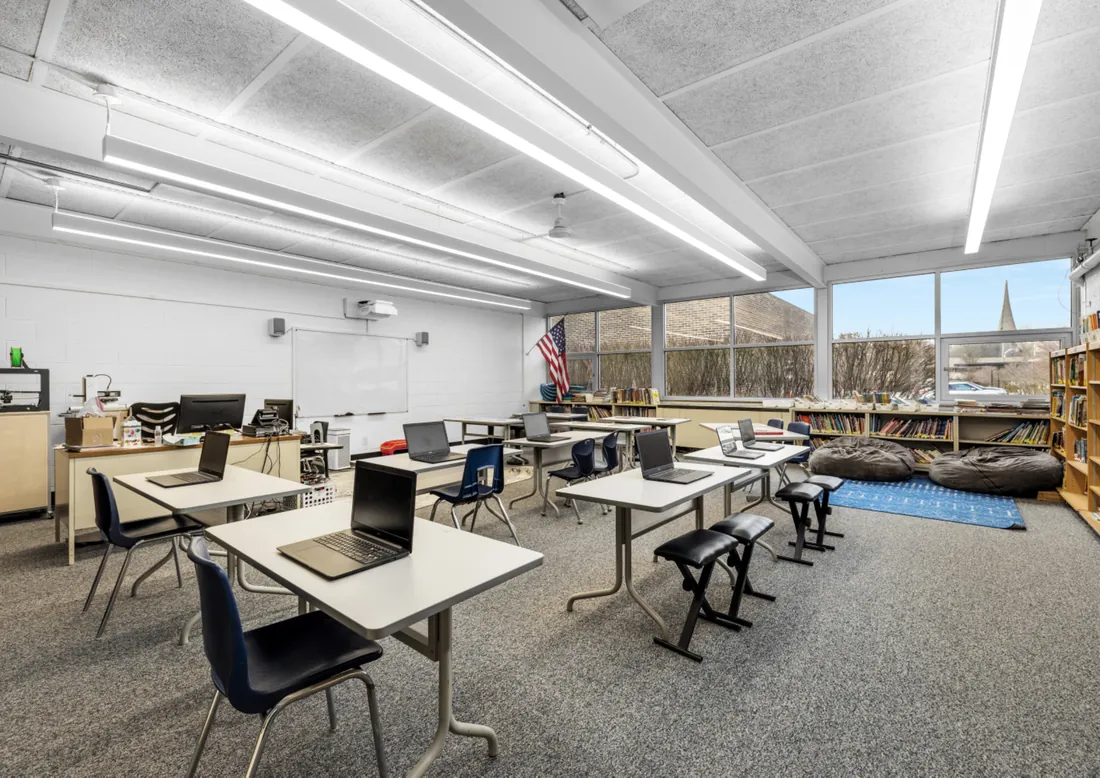 St. Regis classroom with desks and laptops