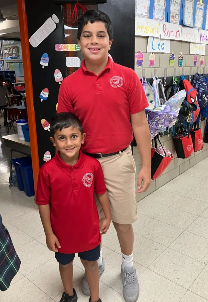 Older and younger St. Regis students together in a classroom