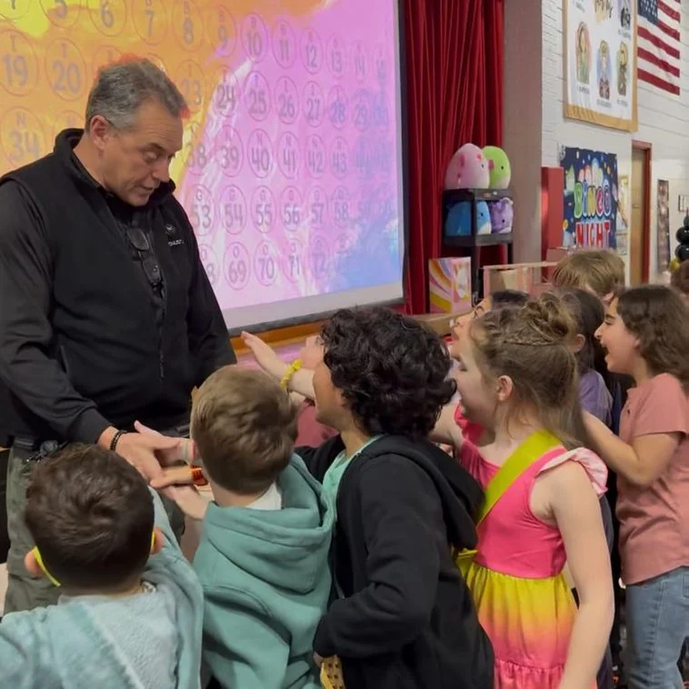 Students gathered around a presenter in class
