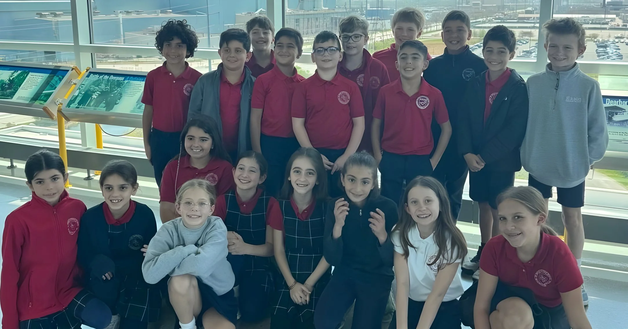 Class of students posing together on a field trip