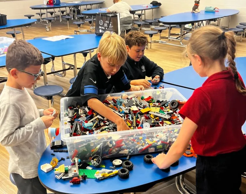 Students building with LEGO bricks